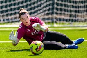 Hearts goalkeeper Emma Thomson gets down to a shot in training.